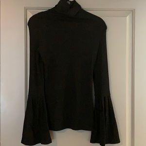 Black turtleneck with bell sleeves